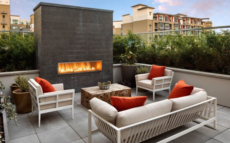 huxley-apartments-outdoor-lounge-and-fireplace